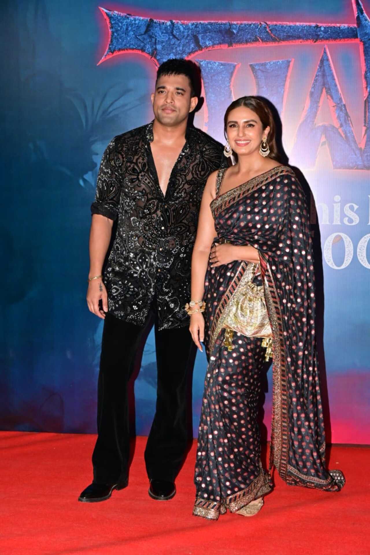Huma Qureshi exuded royalty in an embellished blue saree as she arrived at the screening. She posed at the red carpet with longtime beau Rachit Singh.